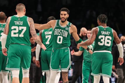 Apr 23, 2022; Brooklyn, New York, USA;  Boston Celtics forward Jayson Tatum (0) with center Daniel Theis (27) and guard Marcus Smart (36) at Barclays Center. Mandatory Credit: Wendell Cruz-USA TODAY Sports