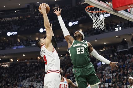 Apr 27, 2022; Milwaukee, Wisconsin, USA;  Milwaukee Bucks guard Wesley Matthews (23) and Chicago Bulls center Nikola Vucevic (9) reach for a rebound during the first quarter during game five of the first round for the 2022 NBA playoffs at Fiserv Forum. Mandatory Credit: Jeff Hanisch-USA TODAY Sports