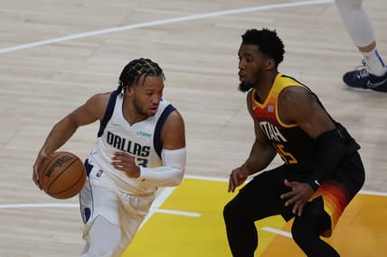 Apr 28, 2022; Salt Lake City, Utah, USA; Dallas Mavericks guard Jalen Brunson (13) drives the ball against Utah Jazz guard Donovan Mitchell (45) in the first quarter during game six of the first round for the 2022 NBA playoffs at Vivint Arena. Mandatory Credit: Rob Gray-USA TODAY Sports