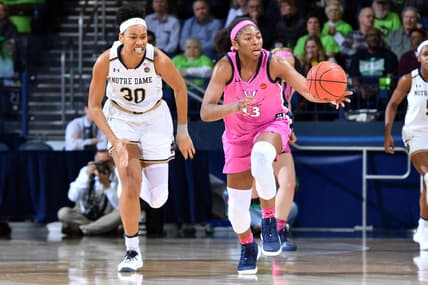 Mar 3, 2019; South Bend, IN, USA; Virginia Cavaliers guard Jocelyn Willoughby (13) grabs a loose ball as Notre Dame Fighting Irish center Mikayla Vaughn (30) pursues in the first half at the Purcell Pavilion. Mandatory Credit: Matt Cashore-USA TODAY Sports
