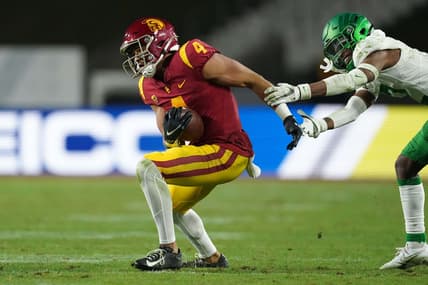 Dec 18, 2020; Los Angeles, California, USA; Southern California Trojans wide receiver Bru McCoy (4) is defended by Oregon Ducks cornerback Mykael Wright (2) during the Pac-12 Championship at United Airlines Field at Los Angeles Memorial Coliseum. Oregon defeated USC 31-24. Mandatory Credit: Kirby Lee-USA TODAY Sports