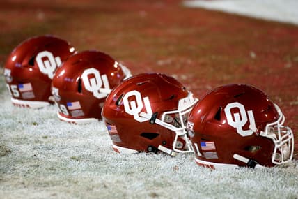 Helmets sit on the field before an NCAA football game between the University of Oklahoma Sooners (OU) and the TCU Horned Frogs at Gaylord Family-Oklahoma Memorial Stadium in Norman, Okla., Saturday, Nov. 23, 2019. Oklahoma won 28-24. [Bryan Terry/The Oklahoman]
