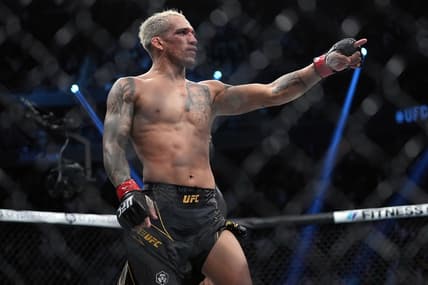 Dec 11, 2021; Las Vegas, Nevada, USA; Charles Oliveira celebrates his victory by submission against Dustin Poirier during UFC 269 at T-Mobile Arena. Mandatory Credit: Stephen R. Sylvanie-USA TODAY Sports
