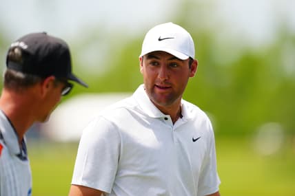 Apr 22, 2022; Avondale, Louisiana, USA; Scottie Scheffler talks to his caddie on the ninth hole green during the second round of the Zurich Classic of New Orleans golf tournament. Mandatory Credit: Andrew Wevers-USA TODAY Sports