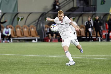 Apr 23, 2022; Portland, Oregon, USA; Real Salt Lake defender Justen Glad (15) takes a shot on goal during the second half against the Portland Timbers at Providence Park. Mandatory Credit: Soobum Im-USA TODAY Sports