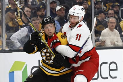 May 6, 2022; Boston, Massachusetts, USA; Carolina Hurricanes center Jordan Staal (11) collides with Boston Bruins defenseman Charlie McAvoy (73) during the first period in game three of the first round of the 2022 Stanley Cup Playoffs at TD Garden. Mandatory Credit: Winslow Townson-USA TODAY Sports