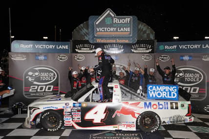 May 6, 2022; Darlington, South Carolina, USA; NASCAR Truck Series driver John Hunter Nemechek (4) celebrates winning the Dead On Tools 200 at Darlington Raceway. Mandatory Credit: Jasen Vinlove-USA TODAY Sports