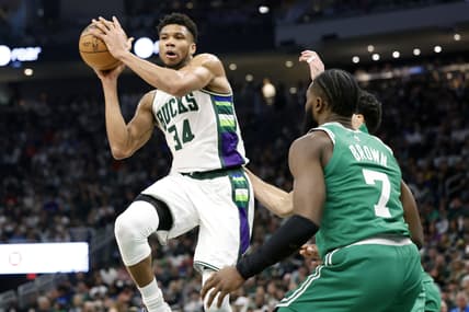May 7, 2022; Milwaukee, Wisconsin, USA; Milwaukee Bucks forward Giannis Antetokounmpo (34) passes the ball under pressure form Boston Celtics guard Jaylen Brown (7) during the second quarter during game three of the second round for the 2022 NBA playoffs at Fiserv Forum. Mandatory Credit: Jeff Hanisch-USA TODAY Sports