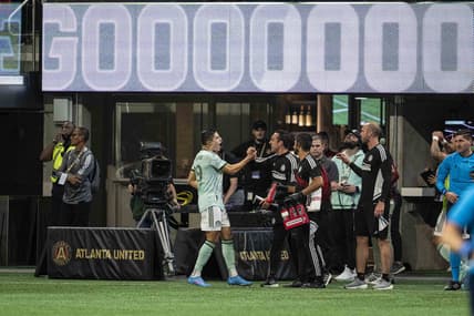 May 7, 2022; Atlanta, Georgia, USA; Atlanta United Ronaldo Cisneros (29) reacts with the bench after scoring his third goal of the first half against the Chicago Fire during the first half at Mercedes-Benz Stadium. Mandatory Credit: Dale Zanine-USA TODAY Sports