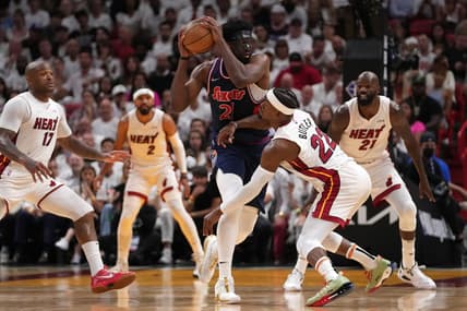 May 10, 2022; Miami, Florida, USA; Miami Heat forward Jimmy Butler (22) battles Philadelphia 76ers center Joel Embiid (21) for the ball during the second half in game five of the second round for the 2022 NBA playoffs at FTX Arena. Mandatory Credit: Jasen Vinlove-USA TODAY Sports