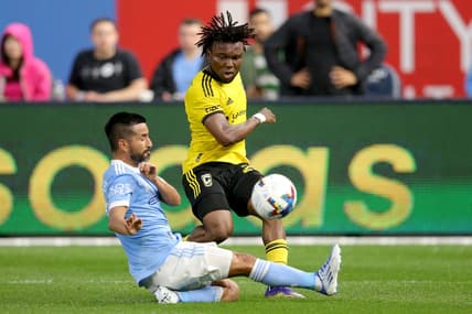 May 14, 2022; New York, New York, USA; Columbus Crew midfielder James Igbekeme (26) passes the ball around New York City FC midfielder Maximiliano Moralez (10) during the first half at Yankee Stadium. Mandatory Credit: Brad Penner-USA TODAY Sports