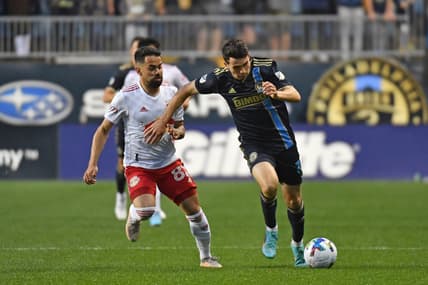May 14, 2022; Philadelphia, Pennsylvania, USA; Philadelphia Union midfielder Leon Flach (31) pushes the ball upfield against New York Red Bulls midfielder Luquinhas (82) during the first half at Subaru Park. Mandatory Credit: Eric Hartline-USA TODAY Sports