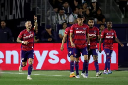 May 14, 2022; Carson, California, USA;  FC Dallas forward Paul Arriola (left) reacts after scoring a goal against the Los Angeles Galaxy during the first half at Dignity Health Sports Park. Mandatory Credit: Kiyoshi Mio-USA TODAY Sports