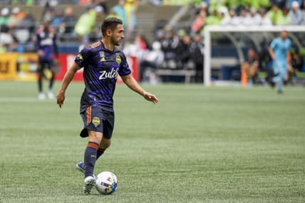 May 15, 2022; Seattle, Washington, USA; Seattle Sounders FC midfielder Cristian Roldan (7) dribbles against the Minnesota United FC during the second half at Lumen Field. Mandatory Credit: Joe Nicholson-USA TODAY Sports