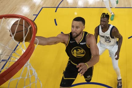 May 18, 2022; San Francisco, California, USA; Golden State Warriors guard Stephen Curry (30) shoots the basketball against Dallas Mavericks forward Reggie Bullock (25) during the first half in game one of the 2022 western conference finals at Chase Center. Mandatory Credit: Kyle Terada-USA TODAY Sports