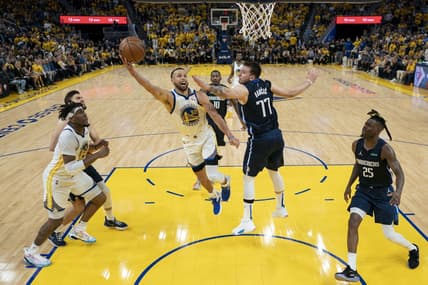 May 20, 2022; San Francisco, California, USA; Golden State Warriors guard Stephen Curry (30) shoots the basketball against Dallas Mavericks guard Luka Doncic (77) during the second half in game two of the 2022 western conference finals at Chase Center. Mandatory Credit: Kyle Terada-USA TODAY Sports
