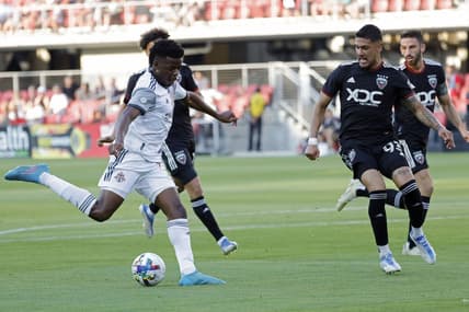 May 21, 2022; Washington, District of Columbia, USA; Toronto FC forward Deandre Kerr (29) shoots the ball as D.C. United defender Tony Alfaro (93) defends in the first half at Audi Field. Mandatory Credit: Geoff Burke-USA TODAY Sports