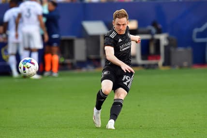 May 22, 2022; Carson, California, USA; Houston Dynamo forward Tyler Pasher (19) scores a goal against the Los Angeles Galaxy during the second half at Dignity Health Sports Park. Mandatory Credit: Gary A. Vasquez-USA TODAY Sports