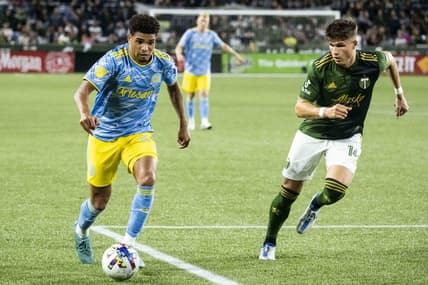 May 22, 2022; Portland, Oregon, USA; Philadelphia Union defender Nathan Harriel (26) controls a pass during the second half against Portland Timbers defender Justin Rasmussen (14) at Providence Park. Philadelphia Union won 2-0. Mandatory Credit: Troy Wayrynen-USA TODAY Sports
