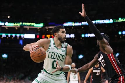 May 23, 2022; Boston, Massachusetts, USA; Boston Celtics forward Jayson Tatum (0) looks to move the ball defended by Miami Heat forward Jimmy Butler (22) in the second half during game four of the 2022 eastern conference finals at TD Garden. Mandatory Credit: Paul Rutherford-USA TODAY Sports