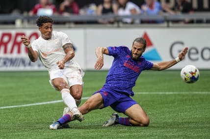 May 28, 2022; Atlanta, Georgia, USA; Columbus Crew forward Erik Hurtado (19) scores a goal past Atlanta United defender Alex De John (3) during the first half at Mercedes-Benz Stadium. Mandatory Credit: Dale Zanine-USA TODAY Sports
