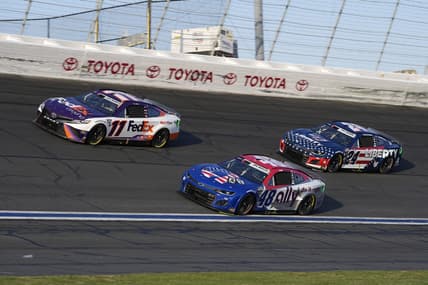 May 29, 2022; Concord, North Carolina, USA; NASCAR Cup Series driver Denny Hamlin (11) races NASCAR Cup Series driver Alex Bowman (48) and NASCAR Cup Series driver William Byron (24) during the Coca-Cola 600 at Charlotte Motor Speedway. Mandatory Credit: Jasen Vinlove-USA TODAY Sports