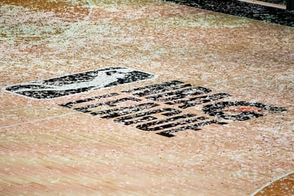 Mar 11, 2021; Orlando, Florida, USA; The NBA G League logo is covered in confetti after the Final between the Delaware Blue Coats and the Lakeland Magic at AdventHealth Arena. Mandatory Credit: Mary Holt-USA TODAY Sports