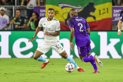 Oct 24, 2021; Orlando, Florida, USA; Orlando City defender Ruan (2) works the ball against New England Revolution defender Christian Mafla (32) during the first half at Orlando City Stadium. Mandatory Credit: Mike Watters-USA TODAY Sports