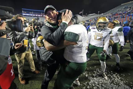 Dec 18, 2021; Shreveport, LA, USA; UAB Blazers head coach Bill Clark embraces  UAB Blazers offensive linemen Colby Ragland (53) after defeating the BYU Cougars during the 2021 Independence Bowl at Independence Stadium. Mandatory Credit: Petre Thomas-USA TODAY Sports