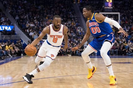 Feb 10, 2022; San Francisco, California, USA; New York Knicks guard Kemba Walker (8) dribbles past Golden State Warriors forward Jonathan Kuminga (00) during the first half at Chase Center. Mandatory Credit: John Hefti-USA TODAY Sports
