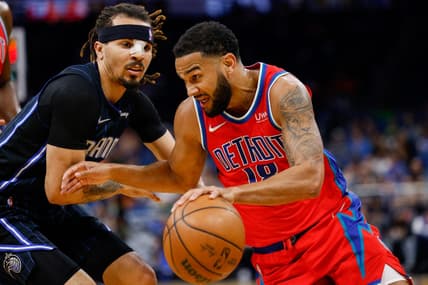 Mar 17, 2022; Orlando, Florida, USA;  Detroit Pistons guard Cory Joseph (18) drives to the basket past Orlando Magic guard Cole Anthony (50) in the first quarter at Amway Center. Mandatory Credit: Nathan Ray Seebeck-USA TODAY Sports