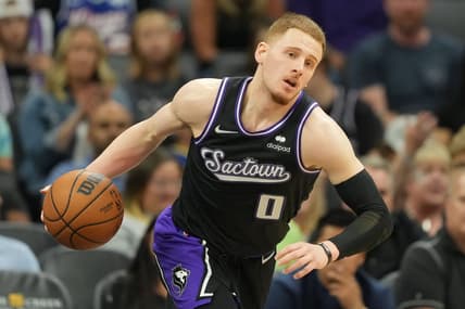 Apr 3, 2022; Sacramento, California, USA; Sacramento Kings guard Donte DiVincenzo (0) dribbles during the fourth quarter against the Golden State Warriors at Golden 1 Center. Mandatory Credit: Darren Yamashita-USA TODAY Sports