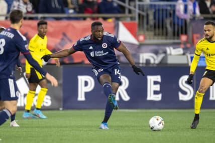 May 7, 2022; Foxborough, Massachusetts, USA; New England Revolution forward Jozy Altidore (14) passes the ball during the second half against the Columbus Crew at Gillette Stadium. Mandatory Credit: Paul Rutherford-USA TODAY Sports