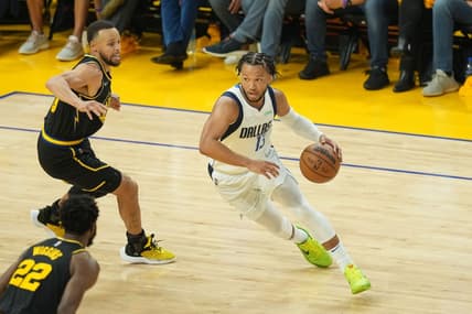 May 18, 2022; San Francisco, California, USA; Dallas Mavericks guard Jalen Brunson (13) dribbles against Golden State Warriors guard Stephen Curry (30) during the second quarter of game one of the 2022 western conference finals at Chase Center. Mandatory Credit: Darren Yamashita-USA TODAY Sports