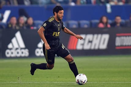 May 25, 2022; Carson, California, USA; Los Angeles FC forward Carlos Vela (10) moves the ball against Los Angeles Galaxy during the first half at Dignity Health Sports Park. Mandatory Credit: Gary A. Vasquez-USA TODAY Sports