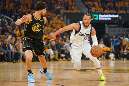 May 26, 2022; San Francisco, California, USA; Dallas Mavericks guard Jalen Brunson (13) dribbles the ball against Golden State Warriors guard Klay Thompson (11) during the first half during game five of the 2022 western conference finals at Chase Center. Mandatory Credit: Cary Edmondson-USA TODAY Sports