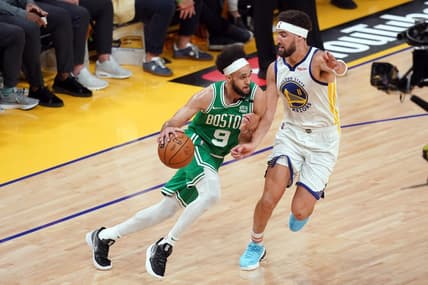Jun 5, 2022; San Francisco, California, USA; Boston Celtics guard Derrick White (9) dribbles against Golden State Warriors guard Klay Thompson (11) in the second quarter during game two of the 2022 NBA Finals at Chase Center. Mandatory Credit: Cary Edmondson-USA TODAY Sports