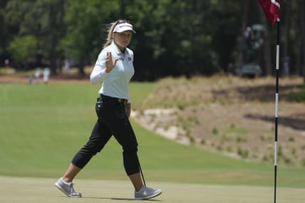 Jun 5, 2022; Southern Pines, North Carolina, USA; Brooke Henderson acknowledges the fans after a putt on the first green during the final round of the U.S. Women's Open. Mandatory Credit: David Yeazell-USA TODAY Sports
