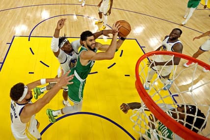 Jun 5, 2022; San Francisco, California, USA; Boston Celtics forward Jayson Tatum (0) shoots the ball against Golden State Warriors center Kevon Looney (5) during game two of the 2022 NBA Finals at Chase Center. Mandatory Credit: Jed Jacobsohn/pool photo-USA TODAY Sports
