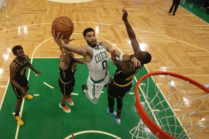 Jun 8, 2022; Boston, Massachusetts, USA; Boston Celtics forward Jayson Tatum (0) attempts a basket in front of Golden State Warriors forward Draymond Green (23) in the second half during game three of the 2022 NBA Finals at TD Garden. Mandatory Credit: Kyle Terada-USA TODAY Sports