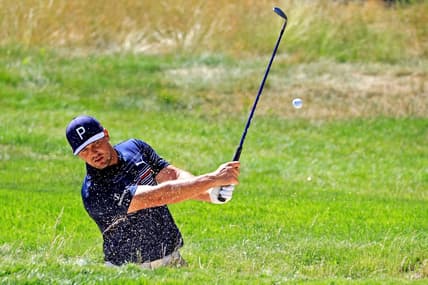 Jun 15, 2022; Brookline, Massachusetts, USA; Bryson DeChambeau plays a shot from a bunker on the 14th hole during a practice round of the U.S. Open golf tournament at The Country Club. Mandatory Credit: Aaron Doster-USA TODAY Sports