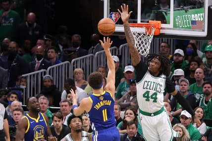 Jun 16, 2022; Boston, Massachusetts, USA; Boston Celtics center Robert Williams III (44) defends a shot from Golden State Warriors guard Klay Thompson (11) during the second quarter of game six in the 2022 NBA Finals at the TD Garden. Mandatory Credit: Paul Rutherford-USA TODAY Sports