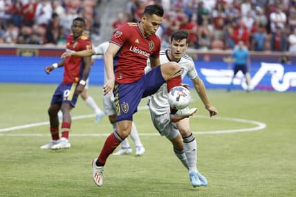 Jun 18, 2022; Sandy, Utah, USA; Real Salt Lake forward Rubio Rubin (14) and San Jose Earthquakes defender Nathan (13) battle in the first half at Rio Tinto Stadium. Mandatory Credit: Jeffrey Swinger-USA TODAY Sports