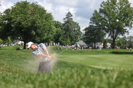 Jun 23, 2022; Cromwell, Connecticut, USA; Rory McIlroy plays a shot from a fairway bunker on the third hole during the first round of the Travelers Championship golf tournament. Mandatory Credit: Vincent Carchietta-USA TODAY Sports
