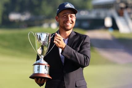 Jun 26, 2022; Cromwell, Connecticut, USA; Xander Schauffele holds up the Travelers Championship Trophy after winning the Travelers Championship golf tournament. Mandatory Credit: Vincent Carchietta-USA TODAY Sports