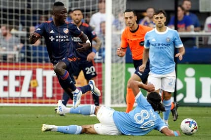 FC Cincinnati midfielder Obinna Nwobodo (5) passes the ball as New York City midfielder Justin Haak (80) goes for the slide tackle in the first half of an MLS soccer game, Wednesday, June 29, 2022, at TQL Stadium in Cincinnati.

New York City At Fc Cincinnati June 29 0021