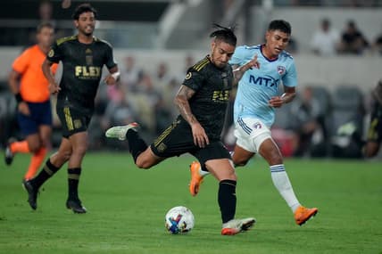 Jun 29, 2022; Los Angeles, California, USA; LAFC forward Cristian Arango (9) is defended by FC Dallas midfielder Edwin Cerrillo (6) in the second half at Banc of California Stadium. Mandatory Credit: Kirby Lee-USA TODAY Sports