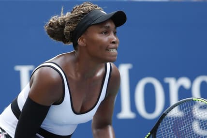 Aug 26, 2019; Flushing, NY, USA; Venus Williams of the United States prepares to return serve against Saisai Zheng of China (not pictured) in the first round on day one of the 2019 U.S. Open tennis tournament at USTA Billie Jean King National Tennis Center. Mandatory Credit: Geoff Burke-USA TODAY Sports