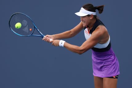 Mar 24, 2021; Miami, Florida, USA; Xiyu Wang of China hits a backhand against Jelena Ostapenko of Latvia (not pictured) in the first round of the Miami Open at Hard Rock Stadium. Mandatory Credit: Geoff Burke-USA TODAY Sports