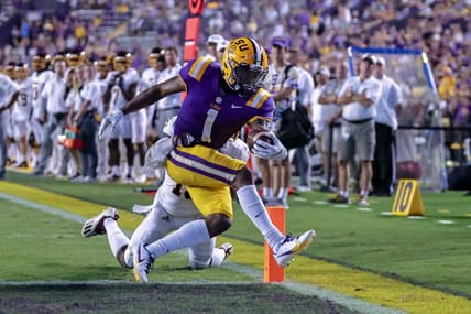 Sep 18, 2021; Baton Rouge, Louisiana, USA;  LSU Tigers wide receiver Kayshon Boutte (1) makes a 2 yard touchdown reception against Central Michigan Chippewas defensive back Donte Kent (19) during the first half at Tiger Stadium. Mandatory Credit: Stephen Lew-USA TODAY Sports